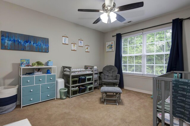 326 Country Bluff Dr, Branson, MO 65616 - carpeted bedroom with baseboards, a ceiling fan, and a crib