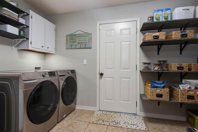 326 Country Bluff Dr, Branson, MO 65616 - laundry area featuring separate washer and dryer, baseboards, cabinet space, and light tile patterned floors