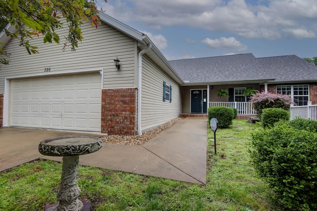 326 Country Bluff Dr, Branson, MO 65616 - traditional-style home with brick siding, a porch, roof with shingles, and concrete driveway