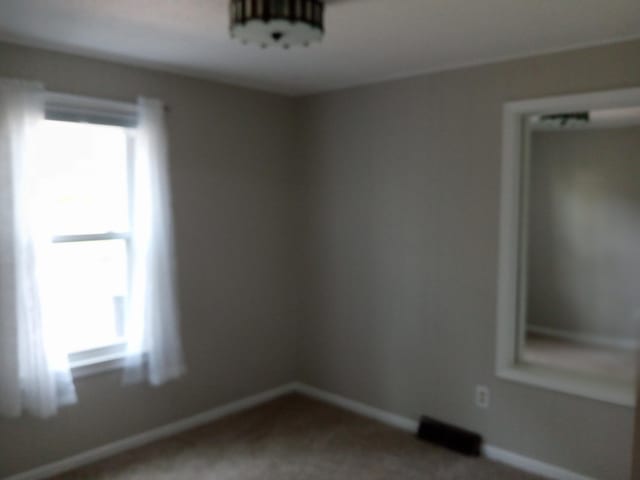 3271 Oak Grove Cir, Flemington, MO 65650 - unfurnished room featuring carpet floors and baseboards