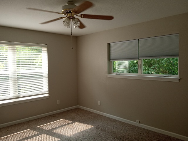 3271 Oak Grove Cir, Flemington, MO 65650 - empty room featuring ceiling fan, baseboards, and carpet floors