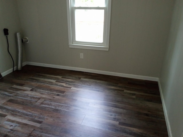 3271 Oak Grove Cir, Flemington, MO 65650 - empty room with dark wood-type flooring and baseboards