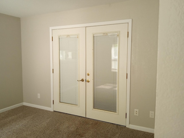3271 Oak Grove Cir, Flemington, MO 65650 - unfurnished bedroom with carpet floors, french doors, and baseboards