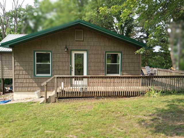 3271 Oak Grove Cir, Flemington, MO 65650 - rear view of property with a deck, a lawn, metal roof, and a standing seam roof