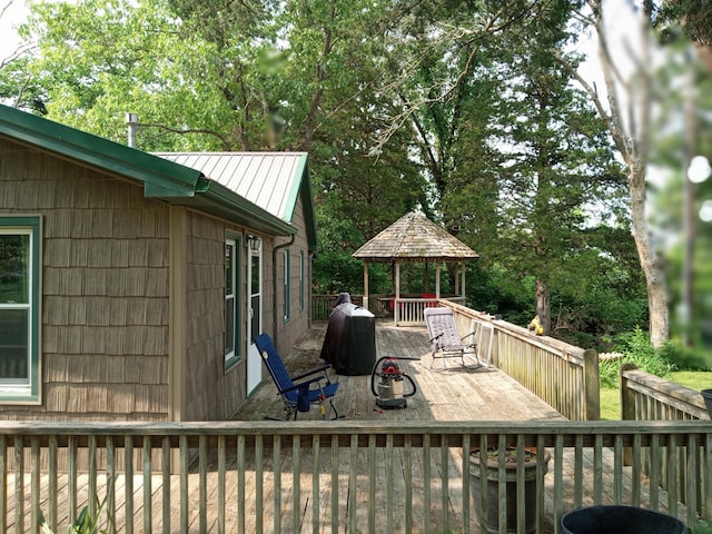 3271 Oak Grove Cir, Flemington, MO 65650 - wooden terrace with a gazebo, view of scattered trees, and area for grilling