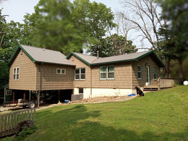 3271 Oak Grove Cir, Flemington, MO 65650 - back of house featuring a lawn, metal roof, and a wooden deck