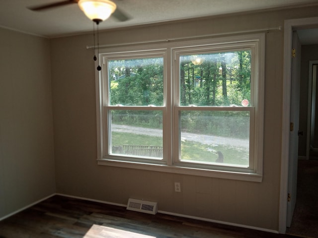 3271 Oak Grove Cir, Flemington, MO 65650 - spare room with plenty of natural light, dark wood-style floors, ceiling fan, and baseboards