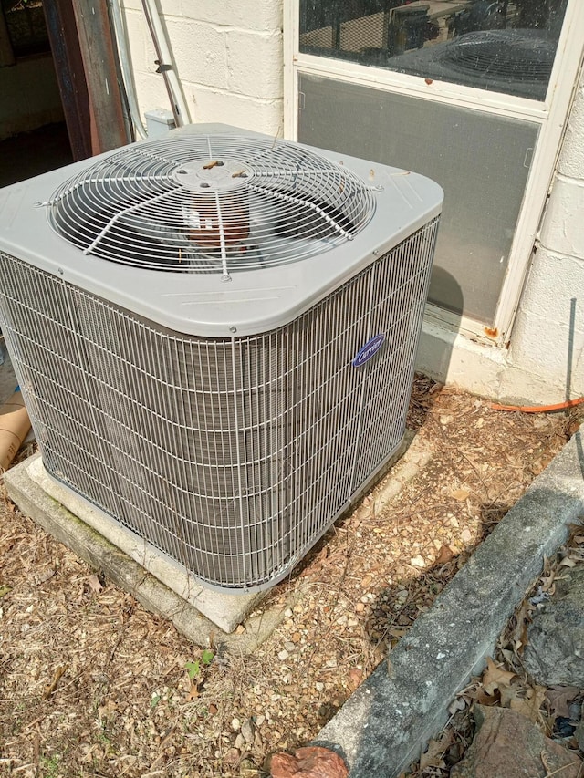3271 Oak Grove Cir, Flemington, MO 65650 - exterior view of cooling unit and concrete block siding