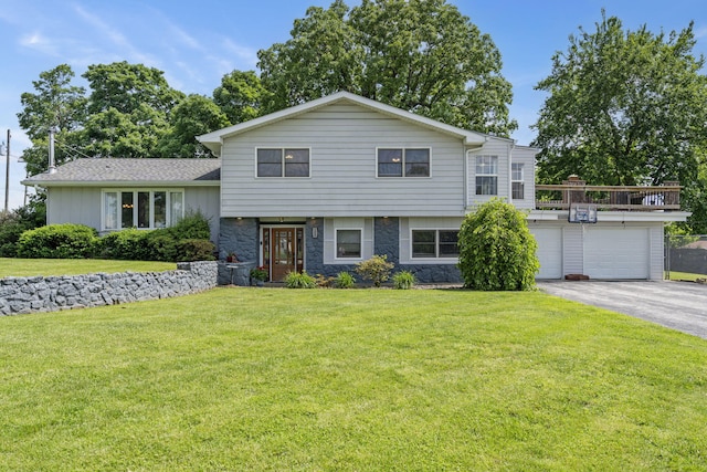 100 W Bumgarner Blvd, Strafford, MO 65757 - split level home featuring asphalt driveway, a front yard, and stone siding