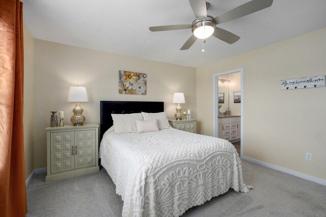 1132 E Lakota St, Nixa, MO 65714 - bedroom with carpet, baseboards, connected bathroom, and a ceiling fan