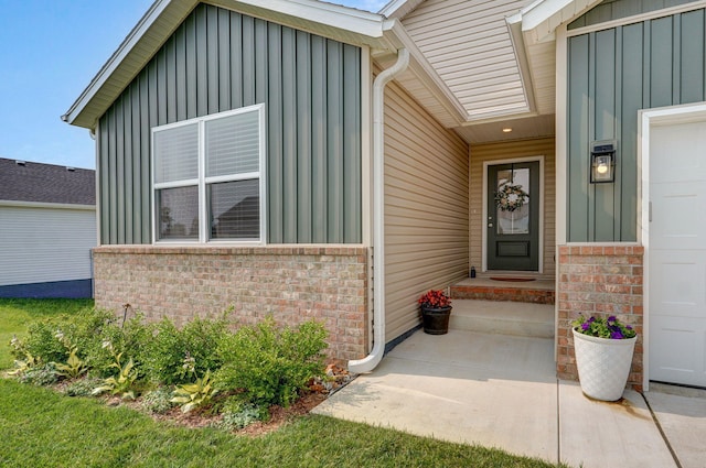 1132 E Lakota St, Nixa, MO 65714 - view of exterior entry with board and batten siding and brick siding
