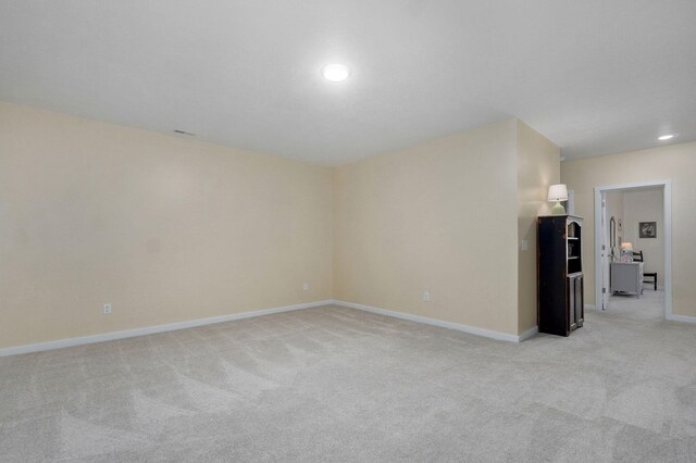 1132 E Lakota St, Nixa, MO 65714 - empty room with light carpet, baseboards, and recessed lighting