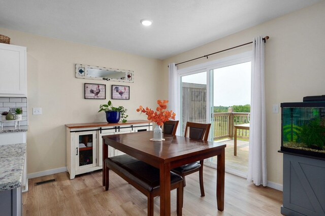 1132 E Lakota St, Nixa, MO 65714 - dining area with light wood-style flooring, baseboards, and recessed lighting