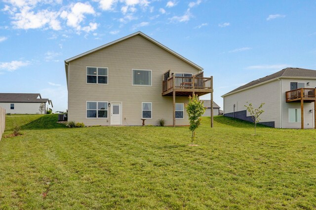 1132 E Lakota St, Nixa, MO 65714 - back of property featuring a lawn, a wooden deck, and cooling unit