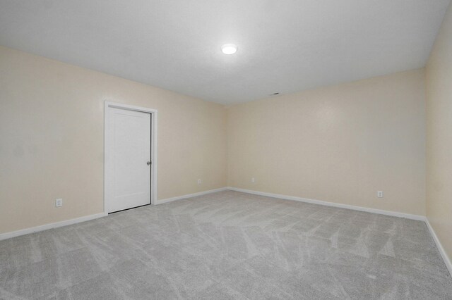 1132 E Lakota St, Nixa, MO 65714 - spare room with light colored carpet and baseboards