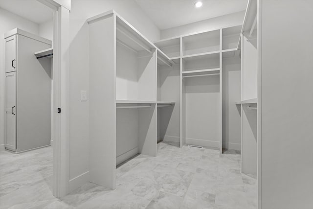5567 E Wild Horse Dr, Springfield, MO 65802 - walk in closet featuring light marble finish floors