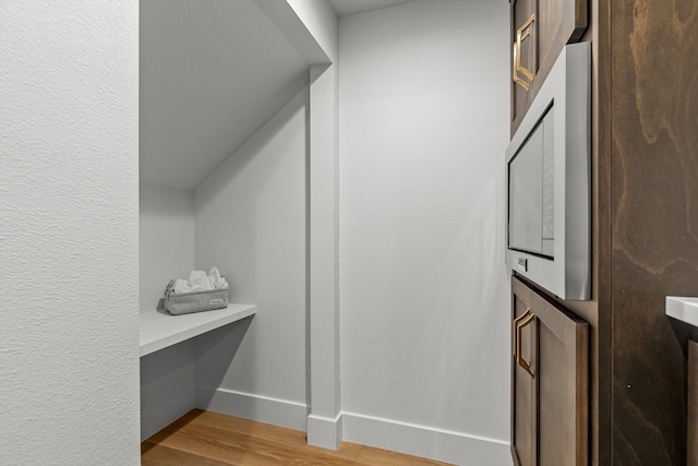 5567 E Wild Horse Dr, Springfield, MO 65802 - walk in closet with light wood-style flooring