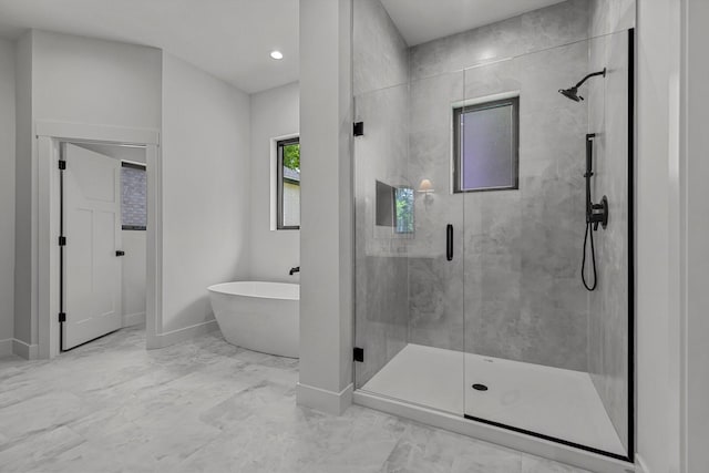 5567 E Wild Horse Dr, Springfield, MO 65802 - full bath featuring a stall shower, marble look tiles, a freestanding bath, baseboards, and recessed lighting
