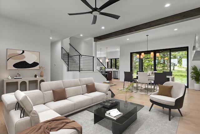 5567 E Wild Horse Dr, Springfield, MO 65802 - living room with stairway, light wood-type flooring, recessed lighting, a ceiling fan, and a chandelier