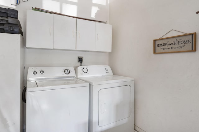 120 Deer Run Rd, Branson, MO 65616 - laundry room featuring cabinet space and washing machine and dryer