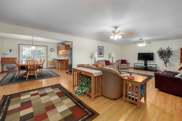 5473 N State Highway 125, Strafford, MO 65757 - living room with light wood finished floors and a ceiling fan