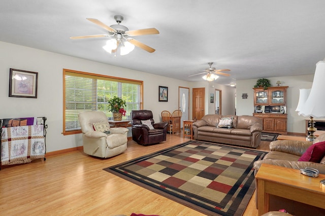 5473 N State Highway 125, Strafford, MO 65757 - living area featuring a ceiling fan, wood finished floors, and baseboards