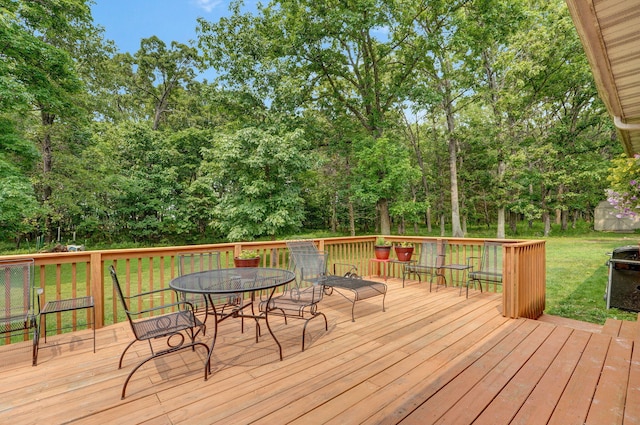 5473 N State Highway 125, Strafford, MO 65757 - wooden terrace featuring outdoor dining space, a lawn, view of scattered trees, and a grill
