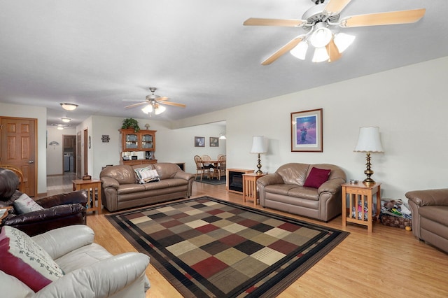 5473 N State Highway 125, Strafford, MO 65757 - living area featuring a ceiling fan and light wood-type flooring