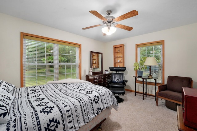 5473 N State Highway 125, Strafford, MO 65757 - carpeted bedroom featuring multiple windows, baseboards, and ceiling fan