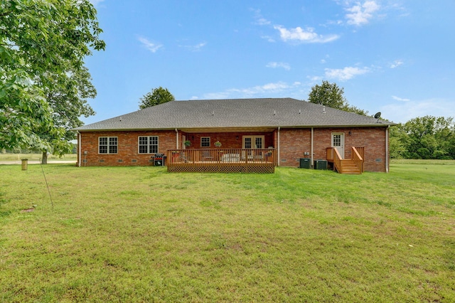 5473 N State Highway 125, Strafford, MO 65757 - back of house featuring french doors, a yard, a wooden deck, brick siding, and central air condition unit
