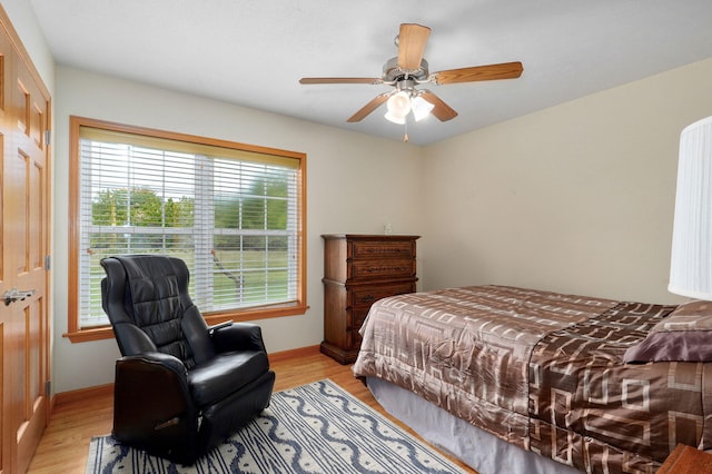 5473 N State Highway 125, Strafford, MO 65757 - bedroom with light wood-type flooring, baseboards, and ceiling fan