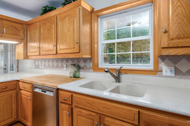 5473 N State Highway 125, Strafford, MO 65757 - kitchen featuring dishwasher, a sink, light countertops, and decorative backsplash