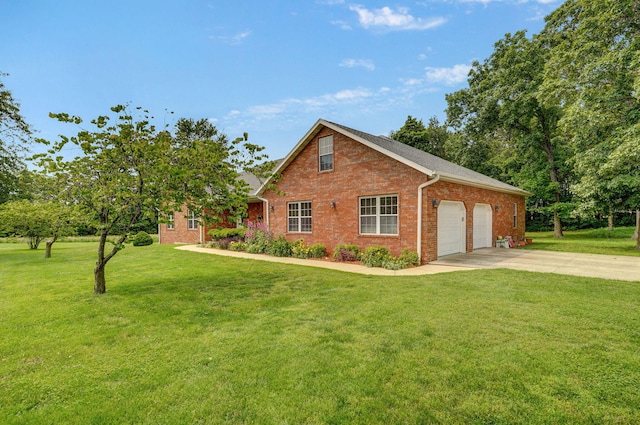 5473 N State Highway 125, Strafford, MO 65757 - view of front of home featuring brick siding, concrete driveway, a garage, and a front lawn