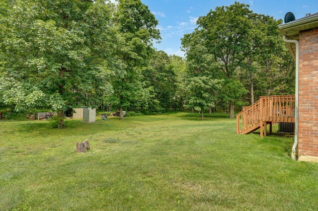 5473 N State Highway 125, Strafford, MO 65757 - view of grassy yard featuring stairway and a wooden deck