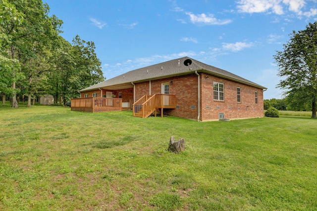 5473 N State Highway 125, Strafford, MO 65757 - rear view of property with brick siding, a wooden deck, and a yard