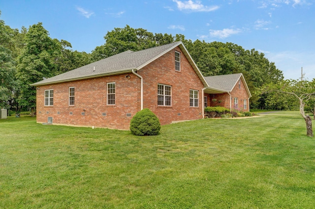 5473 N State Highway 125, Strafford, MO 65757 - view of side of property with brick siding, a lawn, a shingled roof, and crawl space