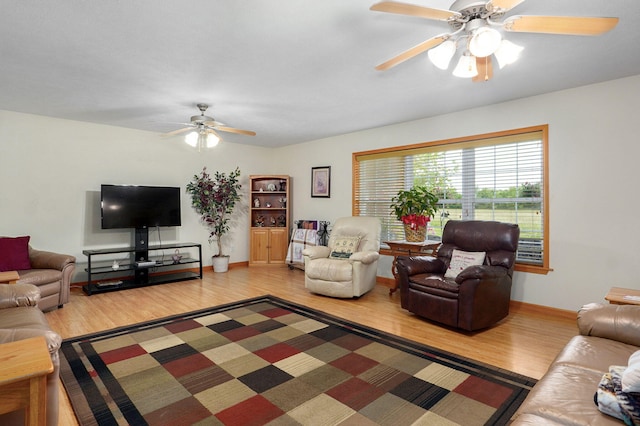 5473 N State Highway 125, Strafford, MO 65757 - living room with a ceiling fan, light wood-style flooring, and baseboards