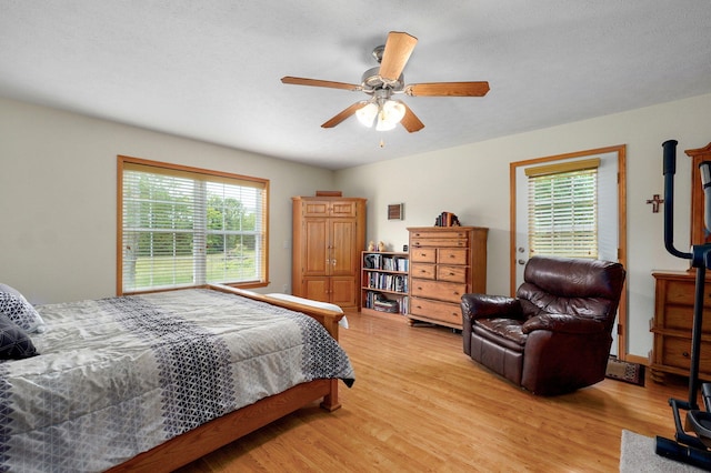 5473 N State Highway 125, Strafford, MO 65757 - bedroom featuring light wood-style flooring and ceiling fan