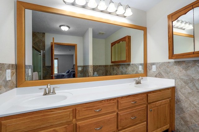 5473 N State Highway 125, Strafford, MO 65757 - full bathroom featuring tile walls, double vanity, a shower stall, ensuite bath, and wainscoting