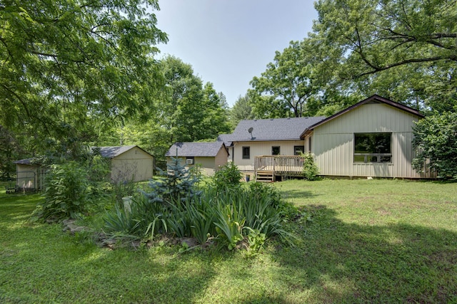 7692 N State Highway H, Springfield, MO 65803 - back of house featuring a wooden deck and a yard