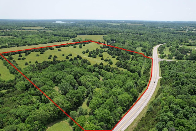 7692 N State Highway H, Springfield, MO 65803 - aerial view of property and surrounding area with property boundaries highlighted and a forest