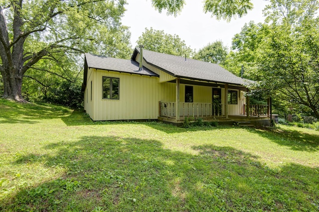 7692 N State Highway H, Springfield, MO 65803 - view of front of property featuring a shingled roof, a front lawn, board and batten siding, and a porch