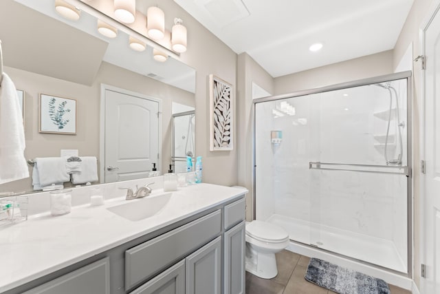 200 Majestic Dr # 423, Branson, MO 65616 - bathroom featuring vanity, toilet, a shower stall, and tile patterned floors