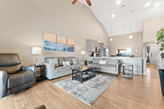 200 Majestic Dr # 423, Branson, MO 65616 - living area with high vaulted ceiling, a ceiling fan, and light wood-type flooring