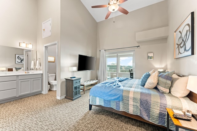 200 Majestic Dr # 423, Branson, MO 65616 - bedroom featuring high vaulted ceiling, access to exterior, light carpet, ensuite bath, and baseboards