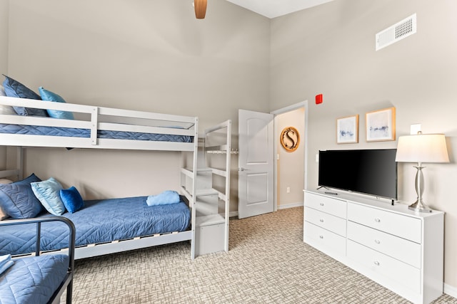 200 Majestic Dr # 423, Branson, MO 65616 - carpeted bedroom featuring baseboards, a ceiling fan, and a high ceiling