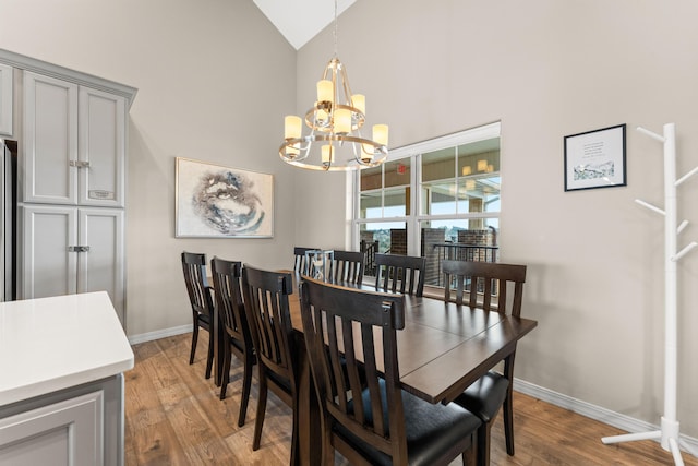 200 Majestic Dr # 423, Branson, MO 65616 - dining room with a chandelier, high vaulted ceiling, light wood-style flooring, and baseboards