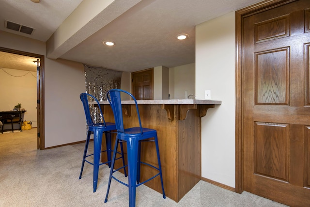 5052 E Cherry Pl, Springfield, MO 65809 - indoor wet bar with light carpet, baseboards, and recessed lighting