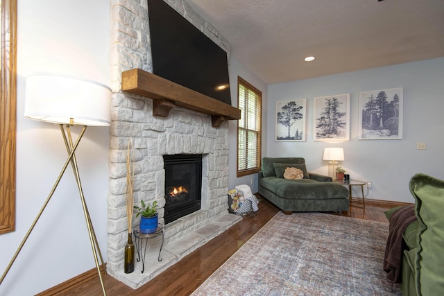 5052 E Cherry Pl, Springfield, MO 65809 - living room with a fireplace, wood finished floors, and baseboards