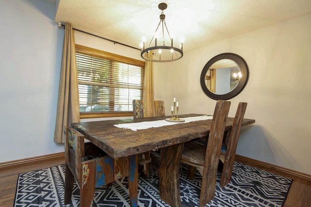 5052 E Cherry Pl, Springfield, MO 65809 - dining space featuring a chandelier, wood finished floors, and baseboards